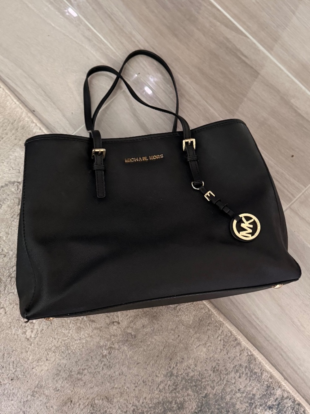 Michael Kors black and gold handbag